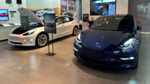 Teslas in a showroom in Miami (Phillip Pessar, CC BY 2.0, via Wikimedia Commons)
