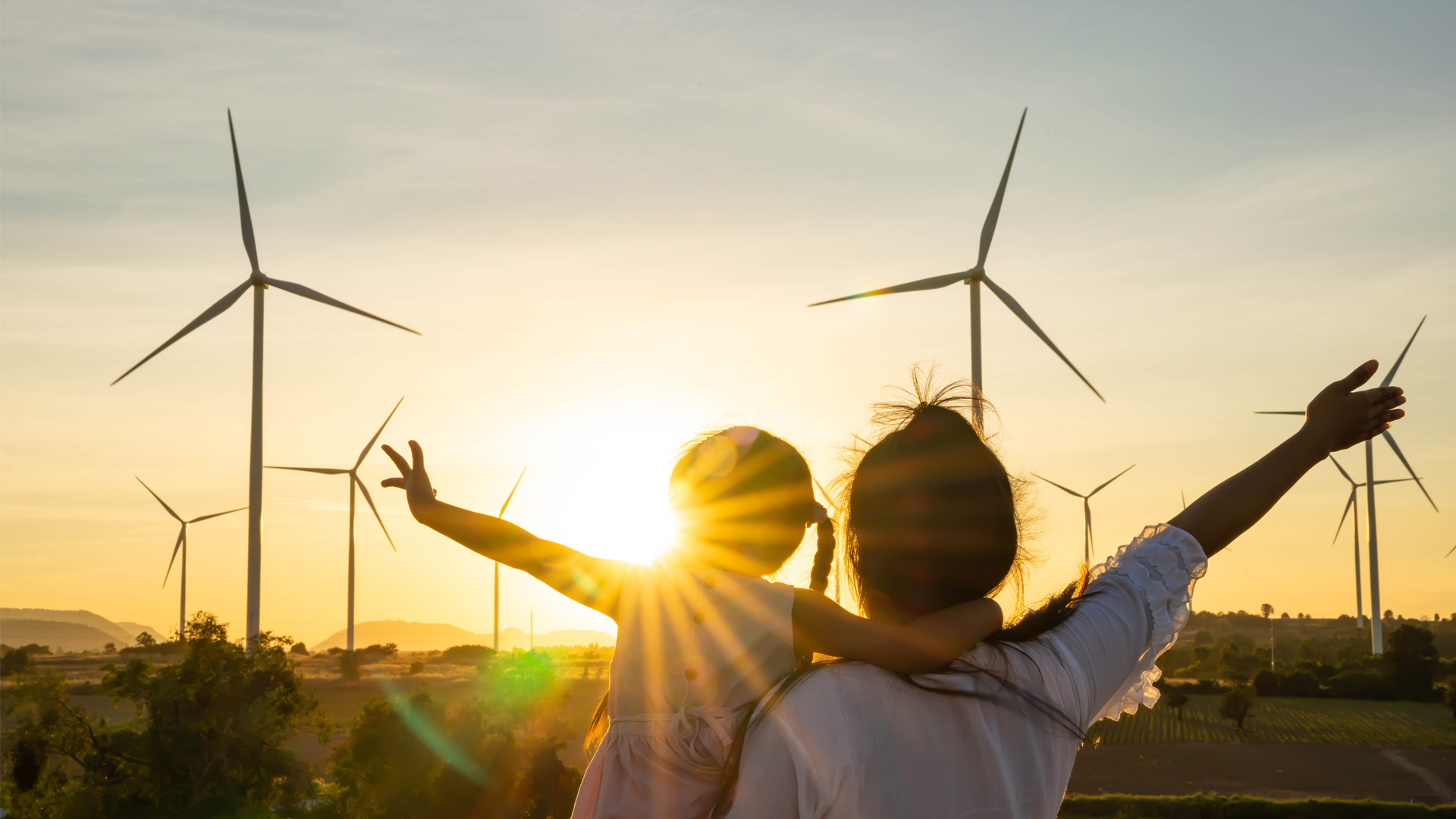 Wind turbines and the sun (iStock image)