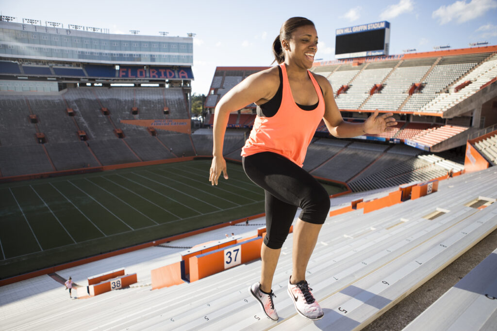 A women running up the steps at the University of Florida's Ben Hill Griffin Stadium for exercise. (Image courtesy of UF/IFAS)