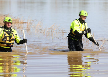 FEMA search-and-rescue team members look for an elderly man that drove off the road into a flooded area in Arkansas after severe storms and flooding on April 7. (Photo by Daniel Rojas/Federal Emergency Management Agency, via Defense Visual Information Distribution Service)