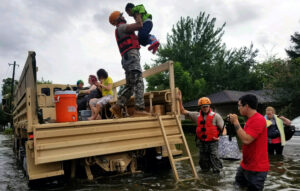 U.S. soldiers with the Texas Army National Guard rescue Houston residents as floodwaters from Hurricane Harvey rise in 2017. (U.S. Army photo by 1st Lt. Zachary West, via Defense Visual Information Distribution Service)
