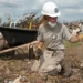 An AmeriCorps member assists with tornado recovery (Julie Denesha/Getty Images via Grist)