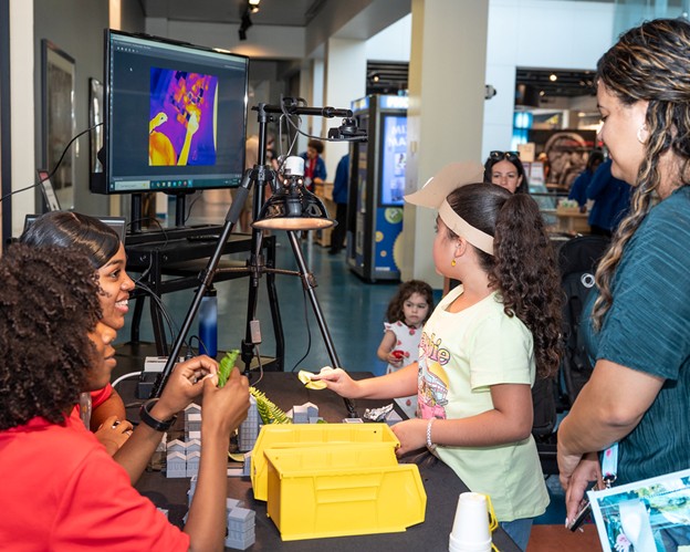 Museum of Discovery and Science visitors taking part in the “Florida’s Climate Future City" activity. (Photo credit: MODS)