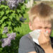 A boy sneezes (iStock image)
