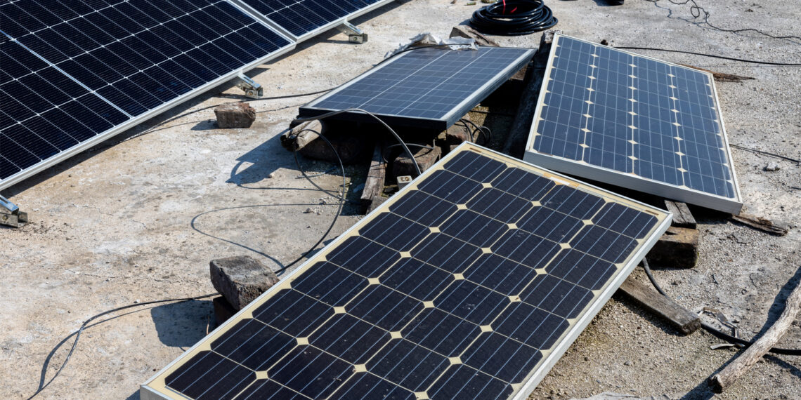 Weathered solar panels on the roof of a house (iStock image)