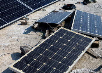 Weathered solar panels on the roof of a house (iStock image)