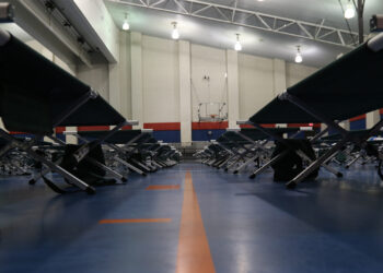 Cots laid out in 2017 at the Sterling Pruitt Activity Center in Beaumont, Texas, for residents who lost their homes during Hurricane Harvey. (Photo by Staff Sgt. Nicolas A. Cloward/128th Mobile Public Affairs Detachment, via Defense Visual Information Distribution Service)