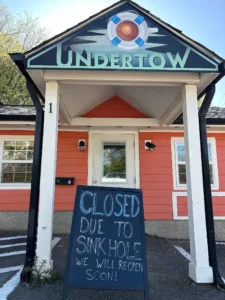 The Undertow Café in Woodfin, North Carolina, was temporarily closed in 2024 due to a sinkhole in its parking lot. (Jason Sandford photo)