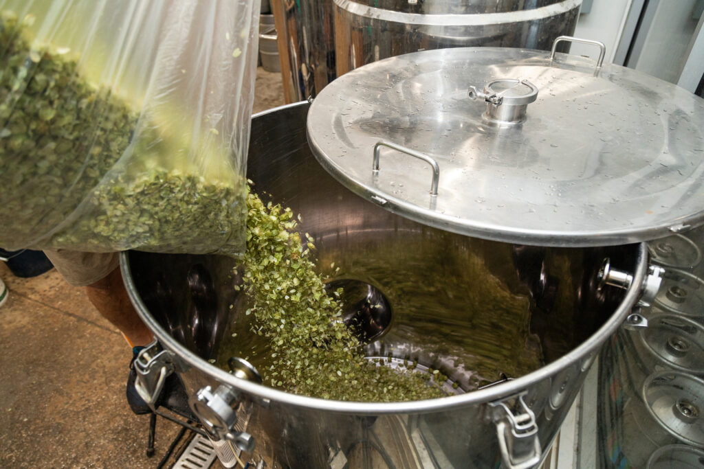 Hops being added to a boiler during the beer-brewing process. (Cat Wofford, UF/IFAS)