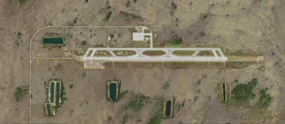 A view of the runway at the abandoned Everglades Jetport in the Big Cypress National Preserve, where the detention center is being built (USGS, public domain, via Wikimedia Commons)