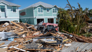 Members of the Florida Air National Guard clear roads in Fort Myers Beach in response to Hurricane Ian on Oct. 1, 2022. (U.S. Air National Guard photo by Senior Airman Jacob Hancock, via Defense Visual Information Distribution Service)