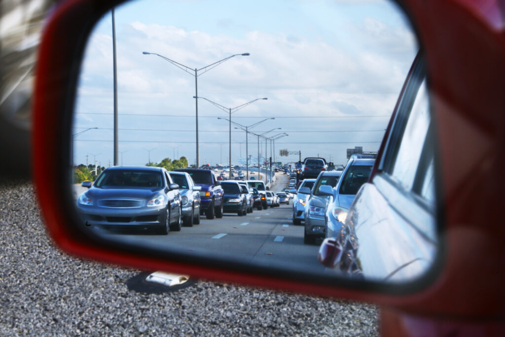 A long of cars on Interstate 95 as seen through a rearview mirror (iStock image)