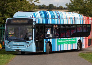 A bus covered in warming stripes in the town of Reading in England, where they were first created. (km30192002, CC BY 2.0, via Wikimedia Commons)