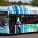 A bus covered in warming stripes in the town of Reading in England, where they were first created. (km30192002, CC BY 2.0, via Wikimedia Commons)