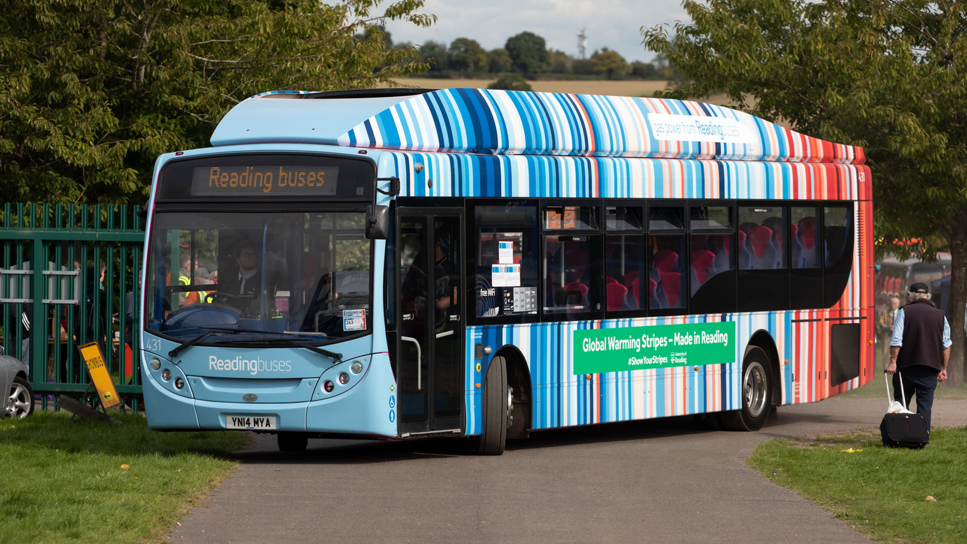 A bus covered in warming stripes in the town of Reading in England, where they were first created. (km30192002, CC BY 2.0, via Wikimedia Commons)