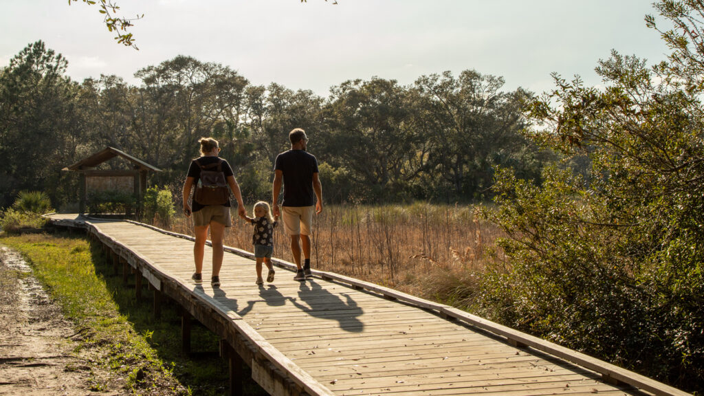 A family walking together along at the Guana River Wildlife Management Area (Kathryn Hennessy, CC BY-SA 4.0, via Wikimedia Commons)