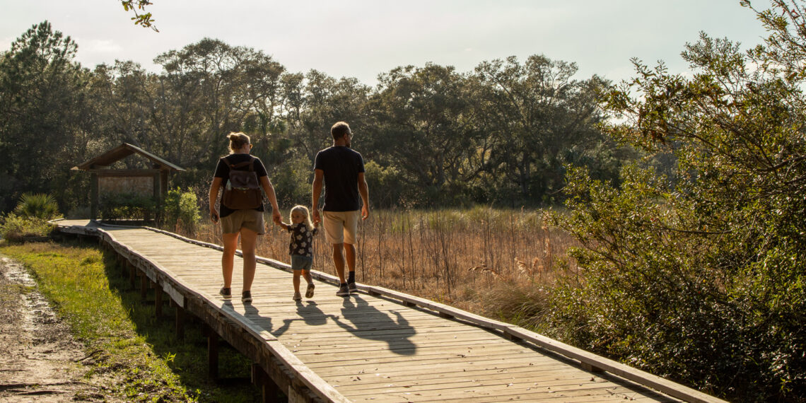 A family walking together along at the Guana River Wildlife Management Area (Kathryn Hennessy, CC BY-SA 4.0, via Wikimedia Commons)