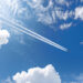 Airliner with contrails flying across the sky (iStock image)