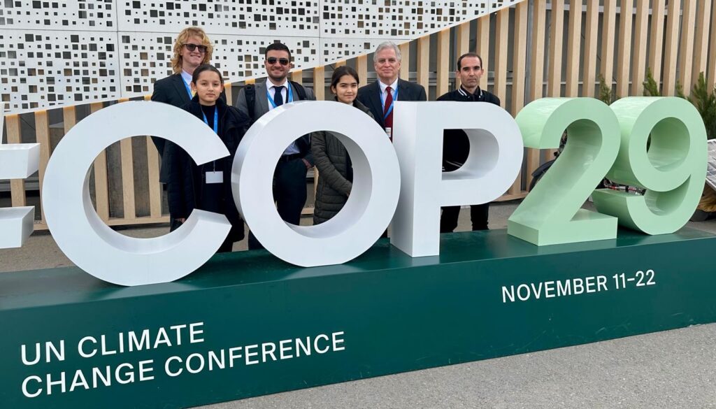 Rock Aboujaoude, third from left, at the COP29 U.N. Climate Change Conference in November with a group that includes John Capece, second from right. (Photo courtesy of John Capece)
