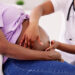 A doula massages a pregnant woman (iStock image)