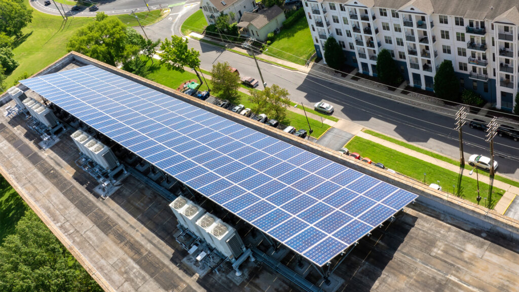 Solar panels on the roof of an apartment building )iStock image)