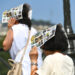 Tourists shield themselves from the sun during a heat wave in Paris, France. (iStock image)