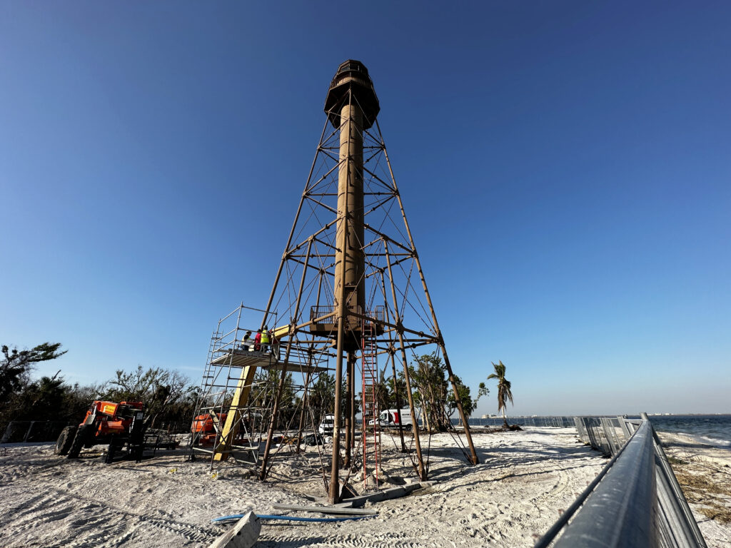 Crews work to repair the Sanibel Lighthouse, which was damaged during Hurricane Ian. Houses around the base of the lighthouse were completely destroyed. (Jocelyn Augustino/FEMA, via Defense Visual Information Distribution Service)