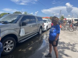 Cultivate Abundance is part of a network of organizations working to address food disparities in Immokalee, growing fresh produce on gardens and plots throughout the community that is distributed every Friday. One of the gardens is located behind a food distribution center run by another group, Misión Peniel. (Photo credit: Grace Hussain)