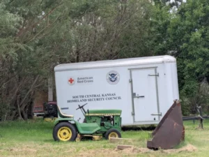 A tractor sits in front of a FEMA trailer in Greensburg, Kansas. (Photo by Anne Vilen)