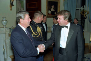 President Ronald Reagan shakes Donald Trump’s hand during a reception that Trump, then a real estate developer, attended at the White House in 1987. (White House Photographic Collection via Wikimedia Commons)