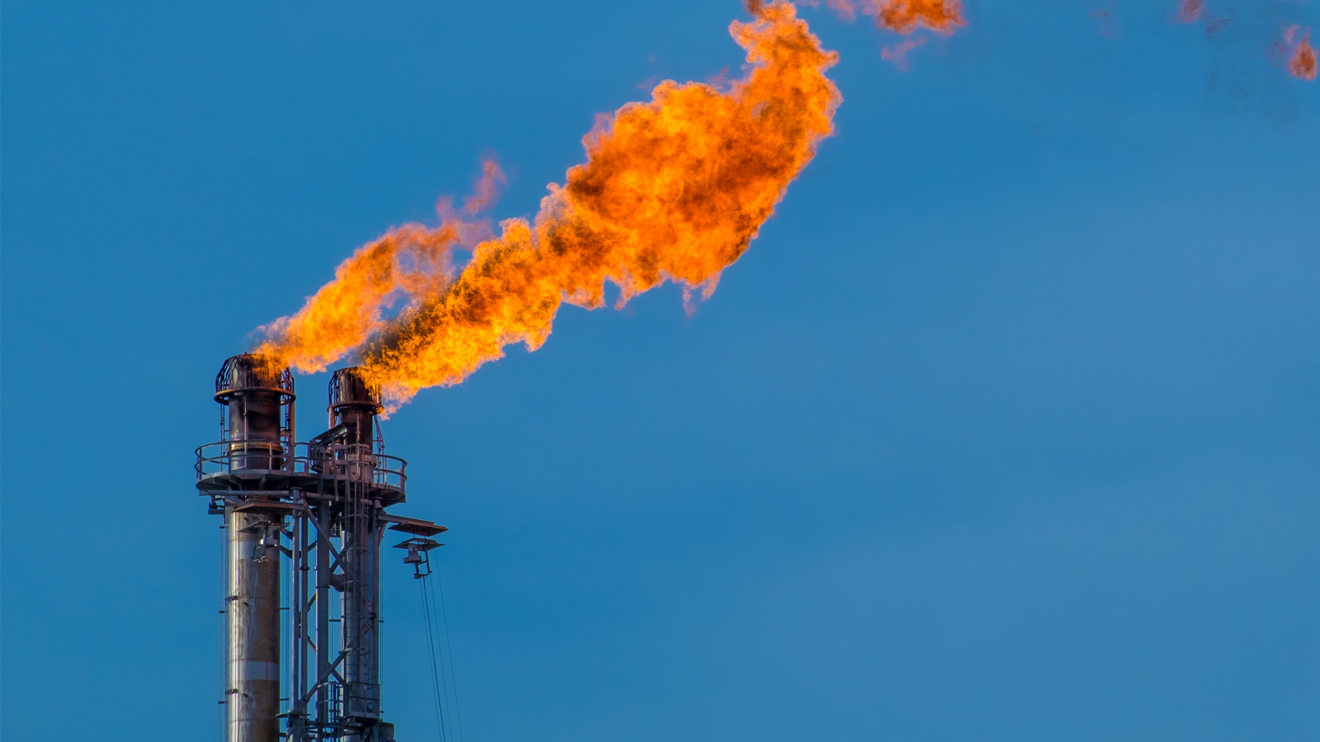 A flare burning off gas at an oil refinery (iStock image)