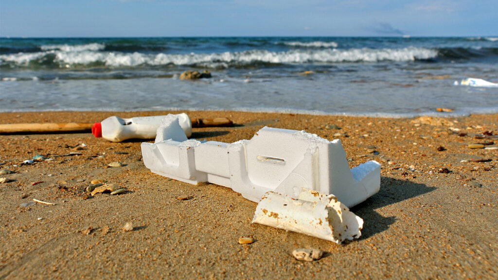 Plastic foam and other trash on a beach (iStock image)