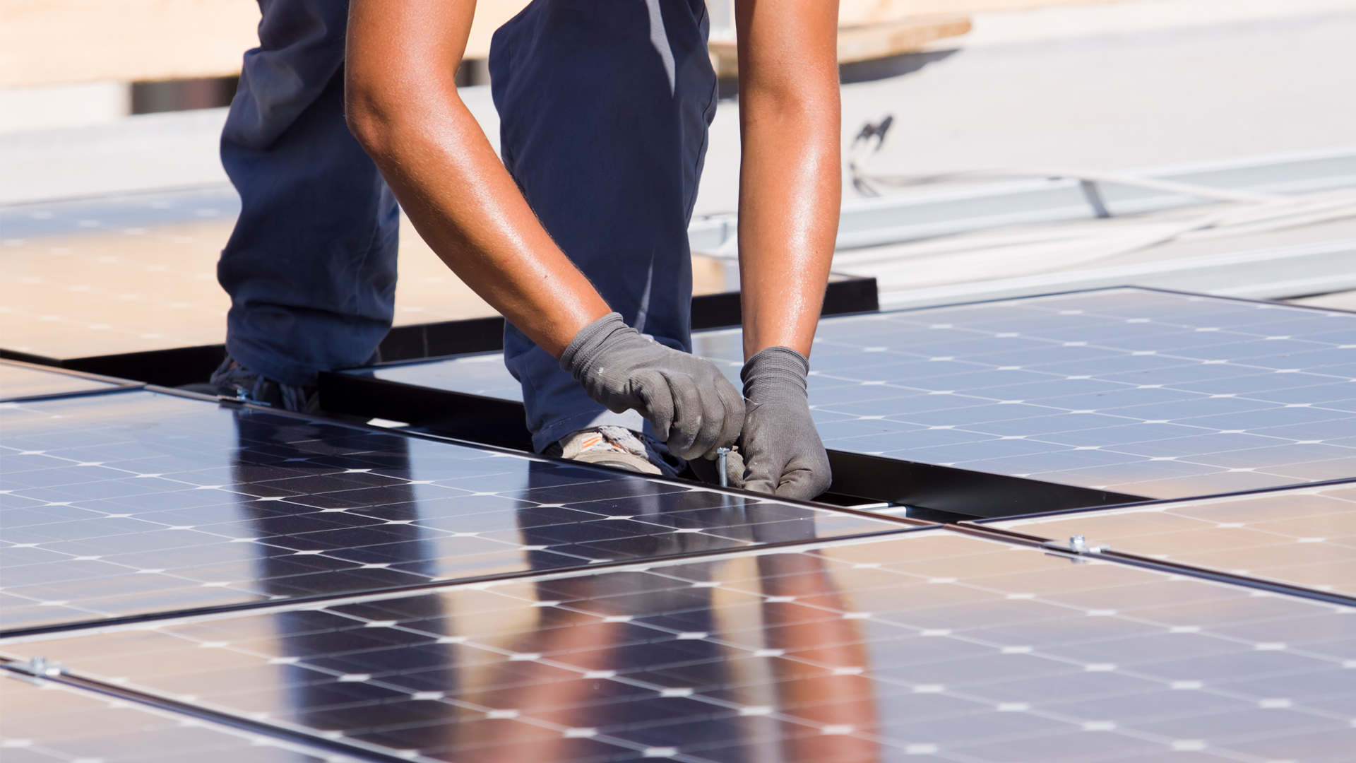 A solar panel being installed on a rooftop (iStock image)