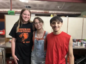These teens help prepare and serve a weekly community dinner at the Pinal-Gila Resilience Hub Network. (Photo by Chris Casillas)