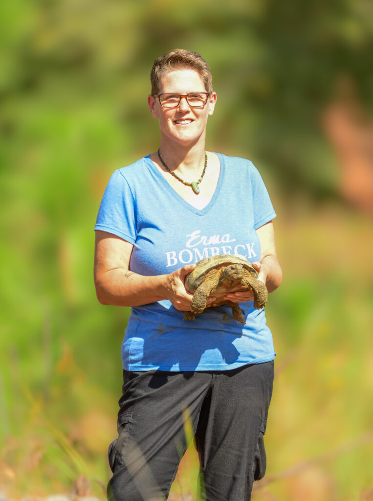 Bonnie Jean Feldkamp releases a rescued gopher tortoise at Nokuse Preserve in Florida. (Photo Credit: Erica Feldkamp )