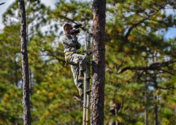 Airman 1st Class Caleb Pavao documents endangered wildlife conservation efforts on Hurlburt Field in 2017. The U.S. Fish and Wildlife Service on Hurlburt Field worked with Eglin Air Force Base staff to create artificial nesting cavities in trees for the red-cockaded woodpecker. (U.S. Air Force photo by Staff Sgt. Marleah Cabano, via Defense Visual Information Distribution Service)