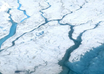 Meltwater runs across the Greenland ice sheet in rivers. The ice sheet is already losing mass and could soon reach a tipping point. (Maria-José Viñas/NASA)
