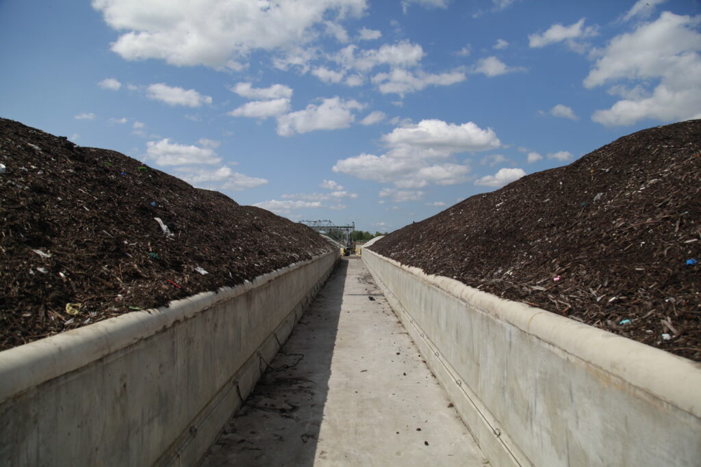 Compost made from food waste is piled in rows at the newly expanded Staten Island Composting Facility in New York City. When people are wasting food, “in many ways, we are throwing out a lot of water, a lot of land, a lot of fertilizer, natural habitat, a lot of things,” says Paul West, a senior scientist at the climate nonprofit Project Drawdown. (Evan Simon/Floodlight)
