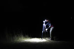 One of Anthony Sleiman’s photography students sets up his gear to take pictures of the night sky in Big Cypress National Preserve on Nov. 30, 2024. (Photo by Sarah Henry)