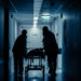 Hospital staff bring a patient on a gurney (iStock image)