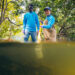 FIU Ph.D. students in Quinete's lab, Joshua Ocheje and Carolina Cuchimaque Lugo, collect water samples to test them for PFAS. (Credit: Anthony Sleiman/Florida International University)