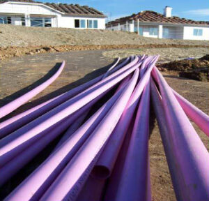 Purple pipes used to distribute reclaimed water (El Dorado Irrigation Distict, Public domain, via Wikimedia Commons)