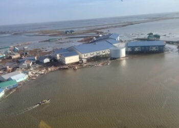 Ex-Typhoon Halong’s storm surge and powerful winds knocked homes off their foundations and set some afloat. (U.S. Coast Guard)