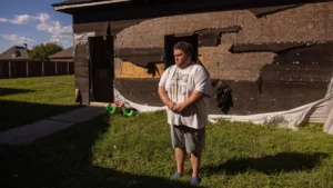 Dean Bye in front of his hurricane-damaged garage in Paulina, Louisiana, last month. (Kathleen Flynn/Grist)