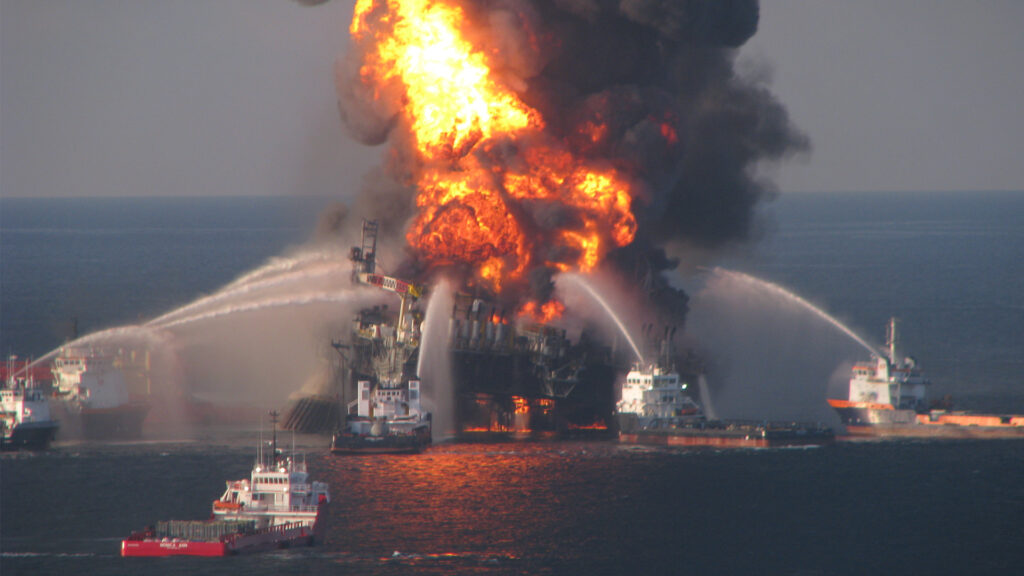 Fire boat response crews battle the blazing remnants of the offshore oil rig Deepwater Horizon on April 21, 2010. (US Coast Guard, Public domain, via Wikimedia Commons)