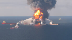 Fire boat response crews battle the blazing remnants of the offshore oil rig Deepwater Horizon on April 21, 2010. (US Coast Guard, Public domain, via Wikimedia Commons)