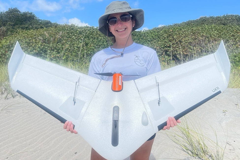 Graduate student and lead author, Summer Manestar, holding the UX11 unmanned aerial vehicle that was used in the study. (FAU)
