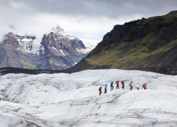 Hikers traverse a mountain range on the Svínafellsjökull Glacier in the Skaftafell Nature Reserve in Iceland. (Image courtesy of Gabby Salazar)
