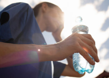 A woman copes with the heat (iStock image)