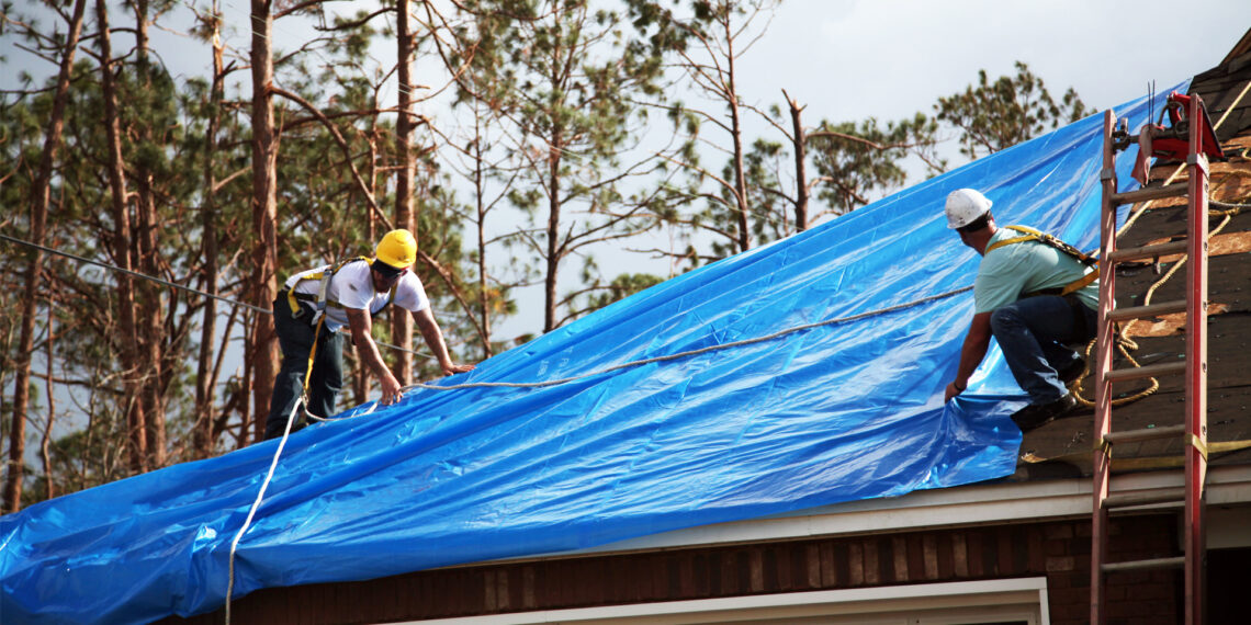 U.S. Army Corps of Engineers workers install temporary roofing on homes of Florida Panhandle residents as part of Operation Blue Roof following Hurricane Michael in 2018 (Pfc. Kaleah Fields/CAISE, via Defense Visual Information Distribution Service)